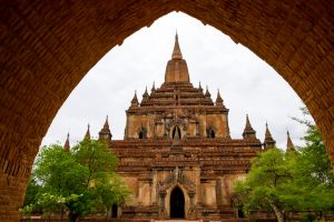 Architectural detail of a temple in Bagan with stone arch entrance