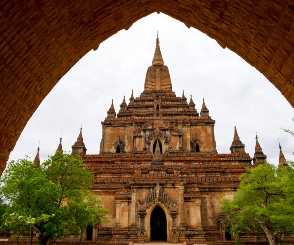 Architectural detail of a temple in Bagan with stone arch entrance